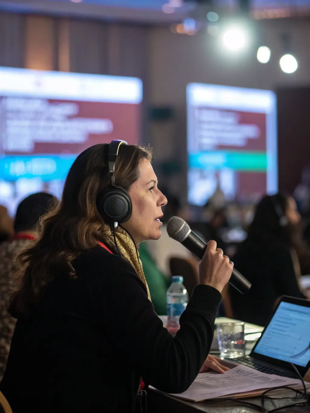 A poignant moment from 'Silent Whispers', capturing an artist sharing their story of overcoming adversity, emphasizing the documentary's powerful storytelling and authentic visuals.